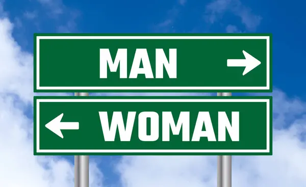 Man Vrouw Verkeersbord Blauwe Lucht Achtergrond — Stockfoto