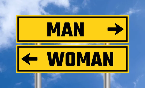 Man Woman Road Sign Blue Sky Background — Stock Photo, Image