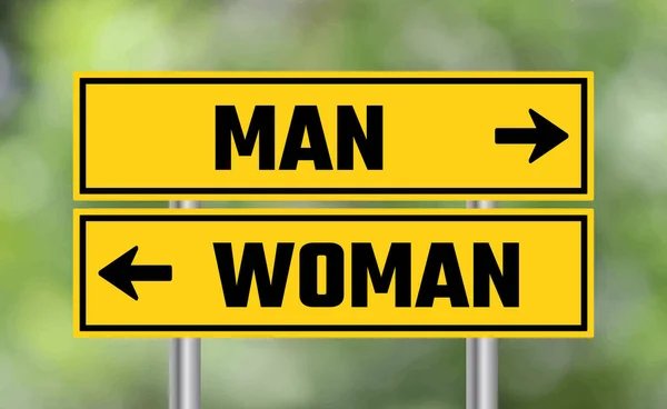 Οδική Πινακίδα Άνδρα Γυναίκας Στο Φόντο Θαμπάδα — Φωτογραφία Αρχείου