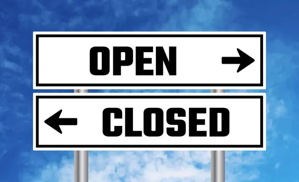 stock image Open or closed road sign on blue sky background