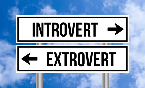 Introvert or extrovert road sign on sky background