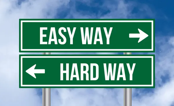 stock image Easy way or hard way road sign on cloudy sky background