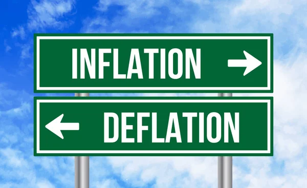Gökyüzü Arka Planında Enflasyon Deflasyon Işareti — Stok fotoğraf