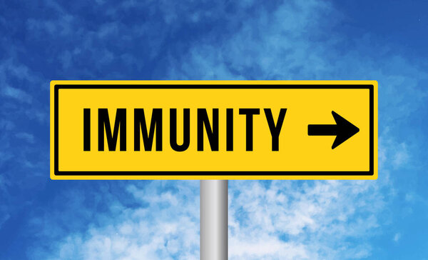 Immunity road sign on sky background