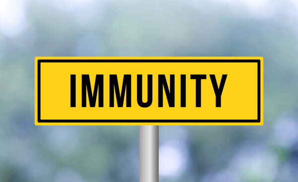 Immunity road sign on blur background