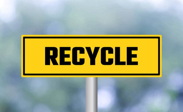Recycle road sign on blur background