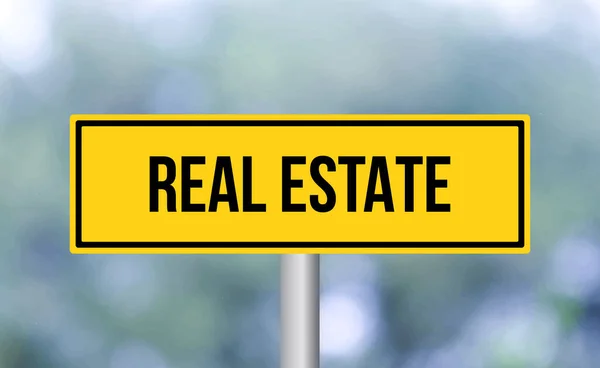Real Estate Road Sign Blur Background — Stock Photo, Image