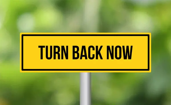 Turn Back Now Road Sign Blur Background — Stock Photo, Image