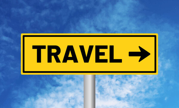 Travel road sign on sky background