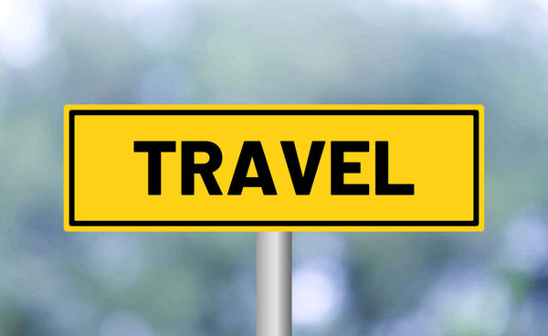 Travel road sign on blur background