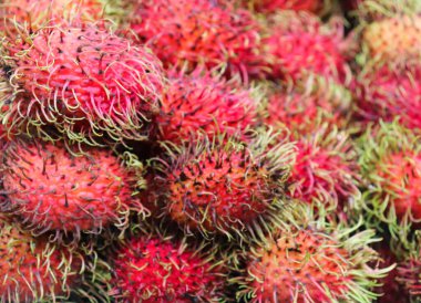 Rambutan geçmişleri. Markette kırmızı Rambutan meyveleri