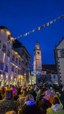 A peaceful demonstration in old town in support of Ukraine against Russian aggression. In the background is a medieval clock tower. February 21, 2025. Ravensburg, Germany