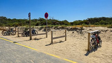 Bicycle parking space near the Negade beach for surfers. June 17, 2025. Soulac-sur-Mer, Medoc, Aquitaine, France