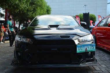Pasay, PH-12 - Mitsubishi Lancer evrimi Bumper 'dan Bumper 16' ya 12 Aralık 2021 'de Pasay, Filipinler' de gerçekleşti. Bumper to Bumper, tüm yıl boyunca Filipinler 'de düzenlenen bir otomobil fuarıdır..