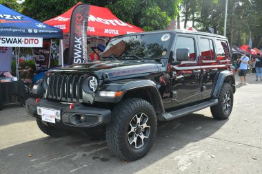 PASAY, PH - DEC 3 - Jeep wrangler rubicon at bumper to bumper car show on December 3, 2022 in Pasay, Philippines. Bumper to bumper is a nationwide car show held in Philippines. clipart