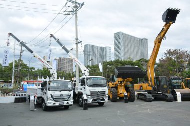 PASAY, PH - FEB 11 - Foton boom trucks at Foton Big Show on February 11, 2023 in Pasay, Philippines. Foton is a Chinese company that manufactures trucks and buses.