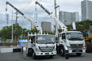 PASAY, PH - FEB 11 - Foton boom trucks at Foton Big Show on February 11, 2023 in Pasay, Philippines. Foton is a Chinese company that manufactures trucks and buses.