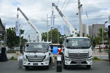 PASAY, PH - FEB 11 - Foton boom trucks at Foton Big Show on February 11, 2023 in Pasay, Philippines. Foton is a Chinese company that manufactures trucks and buses.