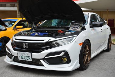 MANILA, PH - JAN 27 - Honda civic mugen Revolve Car Show 'da 27 Ocak 2024 tarihinde Manila, Filipinler' de. Revolve, Filipinler 'de San Beda Üniversitesi' nde düzenlenen yıllık bir otomobil fuarıdır..