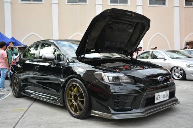 MANILA, PH - JAN 27 - Revolve Car Show 'da 27 Ocak 2024 tarihinde Manila, Filipinler' de Subaru. Revolve, Filipinler 'de San Beda Üniversitesi' nde düzenlenen yıllık bir otomobil fuarıdır..