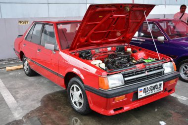 PASIG, PH - MAR 23 - Mitsubishi Lancer 23 Mart 2024 tarihinde Pasig, Filipinler 'de araba kulüpleri savaşında. Araba Kulübü Muharebesi, Filipinler 'de düzenlenen bir araba fuarıdır..