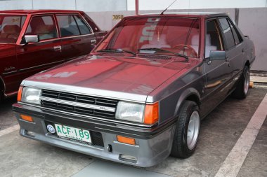 PASIG, PH - MAR 23 - Mitsubishi Lancer 23 Mart 2024 tarihinde Pasig, Filipinler 'de araba kulüpleri savaşında. Araba Kulübü Muharebesi, Filipinler 'de düzenlenen bir araba fuarıdır..