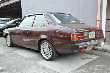 PASIG, PH - MAR 23 - Mitsubishi Lancer 23 Mart 2024 tarihinde Pasig, Filipinler 'de araba kulüpleri savaşında. Araba Kulübü Muharebesi, Filipinler 'de düzenlenen bir araba fuarıdır..