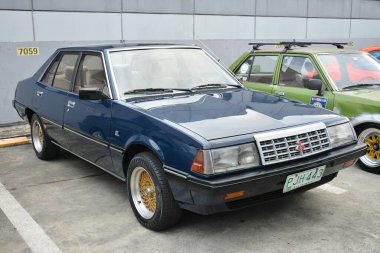 PASIG, PH - MAR 23 - Mitsubishi Lancer 23 Mart 2024 tarihinde Pasig, Filipinler 'de araba kulüpleri savaşında. Araba Kulübü Muharebesi, Filipinler 'de düzenlenen bir araba fuarıdır..