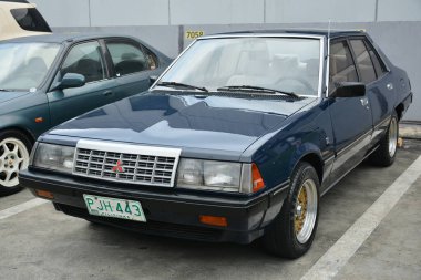 PASIG, PH - MAR 23 - Mitsubishi Lancer 23 Mart 2024 tarihinde Pasig, Filipinler 'de araba kulüpleri savaşında. Araba Kulübü Muharebesi, Filipinler 'de düzenlenen bir araba fuarıdır..