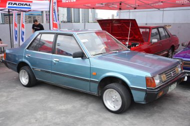 PASIG, PH - MAR 23 - Mitsubishi Lancer 23 Mart 2024 tarihinde Pasig, Filipinler 'de araba kulüpleri savaşında. Araba Kulübü Muharebesi, Filipinler 'de düzenlenen bir araba fuarıdır..
