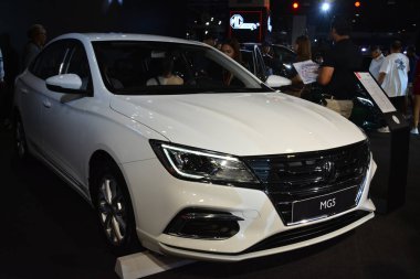 PASAY, PH - APR. 7 - Morris 7 Nisan 2024 tarihinde Manila Uluslararası Otomobil Fuarı 'nda MG5' i Pasay, Filipinler 'de garaja kapattı. Manila International Auto Show, Filipinler 'de düzenlenen yıllık otomobil fuarıdır..