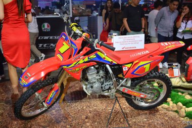 PASAY, PH - MAR 24 - Honda crf 125f at Inside Racing Bike Fest and Trade Show on March 24, 2024 in Pasay, Philippines. Inside racing is a annual motorcycle show event held in Philippines. clipart