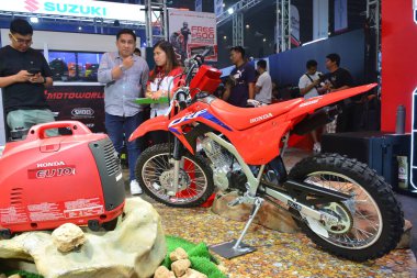 PASAY, PH - MAR 24 - Honda crf 125f at Inside Racing Bike Fest and Trade Show on March 24, 2024 in Pasay, Philippines. Inside racing is a annual motorcycle show event held in Philippines. clipart