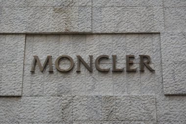 TSIM SHA TSUI, HK - MAY 28 - Moncler store sign at Canton road on May 28, 2024 in Tsim Sha Tsui, Hong Kong. Moncler is a Italian luxury fashion brand headquartered in Milan, Italy. clipart