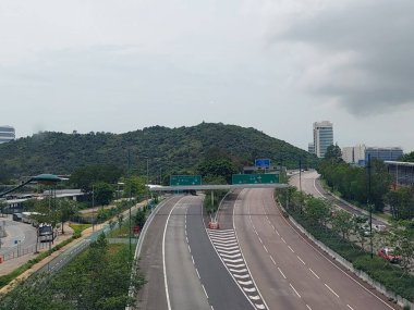 TUNG CHUNG, HK - Tung chung highway on May 25, 2024 in Tung Chung, Hong Kong. Tung chung meaning eastern stream is an area on the northwestern coast of Hong Kong. clipart