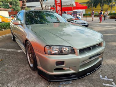 Pasay, PH-NOV 9 - PMX veya Filipin motor sporları fuarında Nissan silueti 9 Kasım 2024 tarihinde Pasay, Filipinler 'de. PMX, Filipinler 'de düzenlenen yıllık bir yarış arabası etkinliğidir..