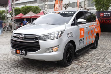 PASAY, PH - DEC 7 - Toyota innova at bumper 2 bumper car show on December 7, 2024 in Pasay, Philippines. Bumper 2 bumper is a aftermarket car show event held in Philippines. clipart