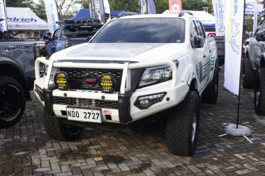 PASAY, PH - DEC 7 - Nissan navara at bumper 2 bumper car show on December 7, 2024 in Pasay, Philippines. Bumper 2 bumper is a aftermarket car show event held in Philippines. clipart