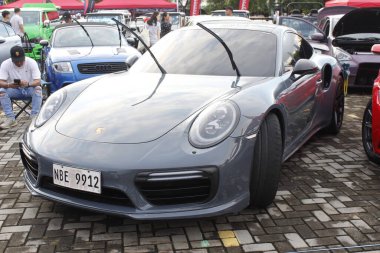 Pasay, PH-7 - Porsche 911 tampon 2 araba fuarında 7 Aralık 2024 tarihinde Pasay, Filipinler 'de. Tampon 2, Filipinler 'de düzenlenen bir piyasa sonrası araba fuarıdır..