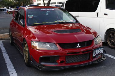 MUNTINLUPA, PH - JAN 28 - Mitsubishi lancer at Neo classic car show on January 19, 2025 in Muntinlupa, Philippines. Neo classic is a aftermarket car show event in Philippines. clipart