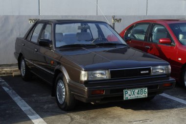 PASIG, PH - MAR 23 - Nissan sentra 23 Mart 2025 tarihinde Pasig, Filipinler 'de otomobil tutkusunda. United Auto Story, Filipinler 'de düzenlenen bir otomobil fuarıdır..