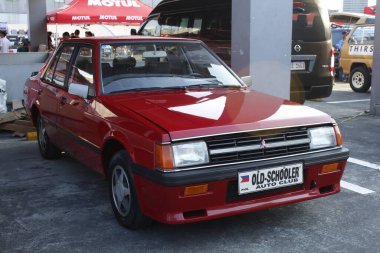 PASIG, PH - MAR 23 - Mitsubishi Lancer 23 Mart 2025 tarihinde Pasig, Filipinler 'de otomobil tutkusunda. United Auto Story, Filipinler 'de düzenlenen bir otomobil fuarıdır..