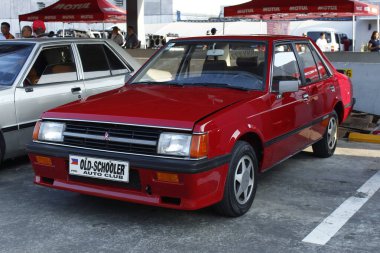 PASIG, PH - MAR 23 - Mitsubishi Lancer 23 Mart 2025 tarihinde Pasig, Filipinler 'de otomobil tutkusunda. United Auto Story, Filipinler 'de düzenlenen bir otomobil fuarıdır..