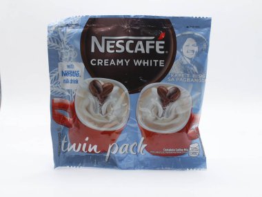 MANILA, PH - 22 Şubat - Nescafe kremalı beyaz ikiz paketi 22 Şubat 2025 tarihinde Manila, Filipinler 'de. Nescafe, Nestle tarafından satılan bir kahve markasıdır..