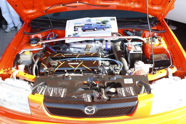 Pasay, PH - APR 13 - Mazda 323 motorlu Manila Uluslararası Otomobil Fuarı (MIAS) 13 Nisan 2025 tarihinde Pasay, Filipinler 'de. MIAS, Filipinler 'de düzenlenen bir otomobil fuarıdır..