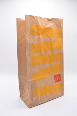 MANILA, PH - FEB 22 - Mcdonalds brown paper bag on February 22, 2025 in Manila, Philippines. Mcdonalds is a fast food restaurant in USA.