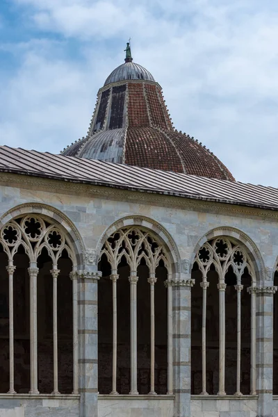 Detail of dome and windows at catholic basilica in Pisa