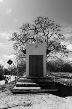 Black and white photo of closed little chapel isolated in Brazils northeastern region clipart