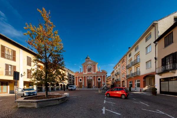 stock image Boves, Cuneo, Piedmont, Italy - November 22, 2022: Piazza dell'Olmo (Elm tree square), in the background parish church of san Bartolomeo