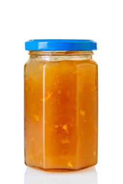 Apricot jam in Glass jar with blue cap isolated on white with clipping path